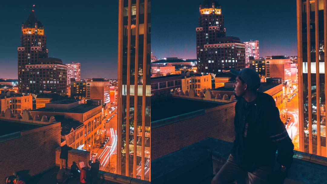 Ijyoyo sitting on ledge at night in Milwaukee