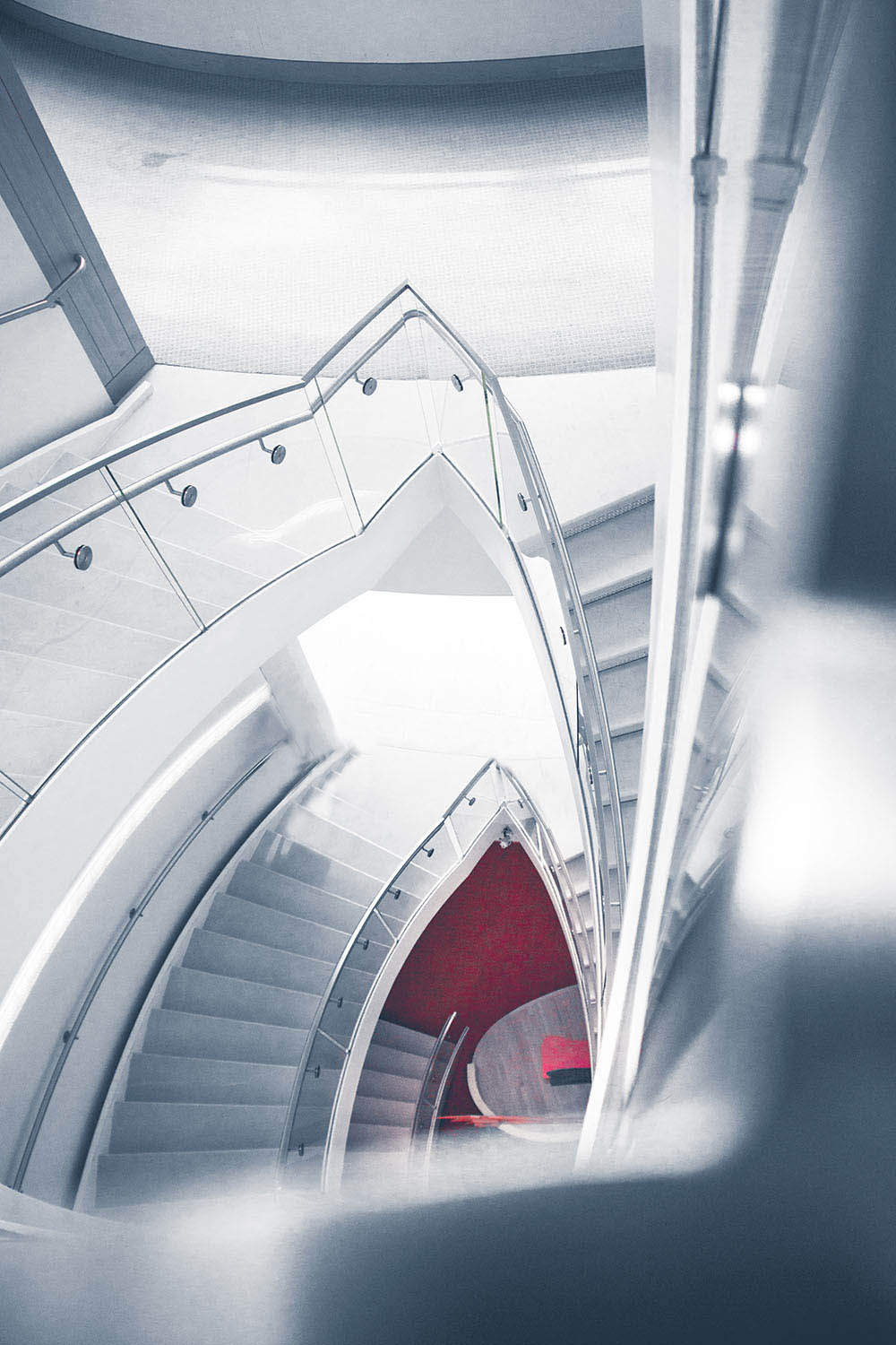 Futuristic silver spiral staircase.