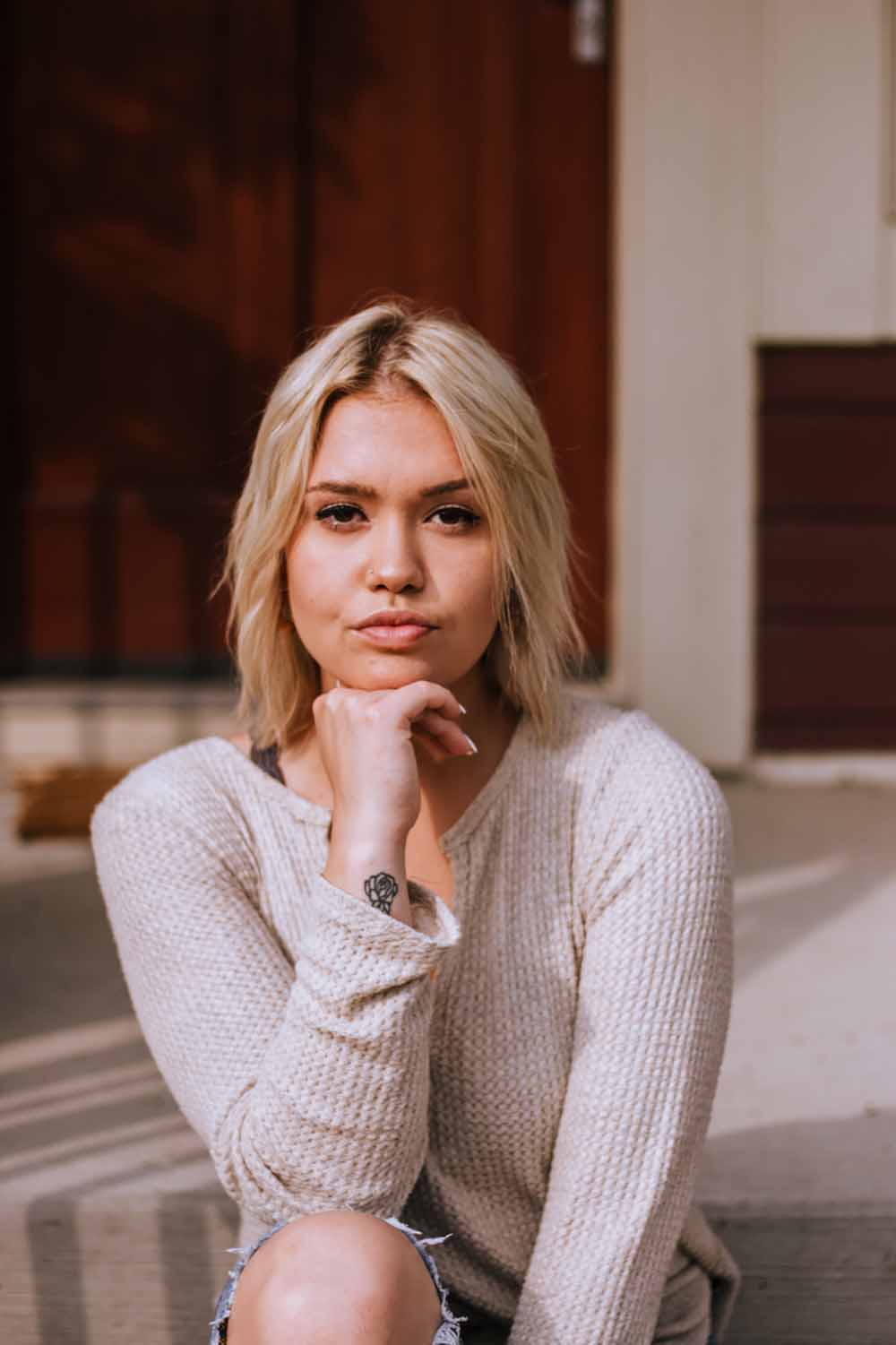 girl model poses for photoshoot in thick sweater