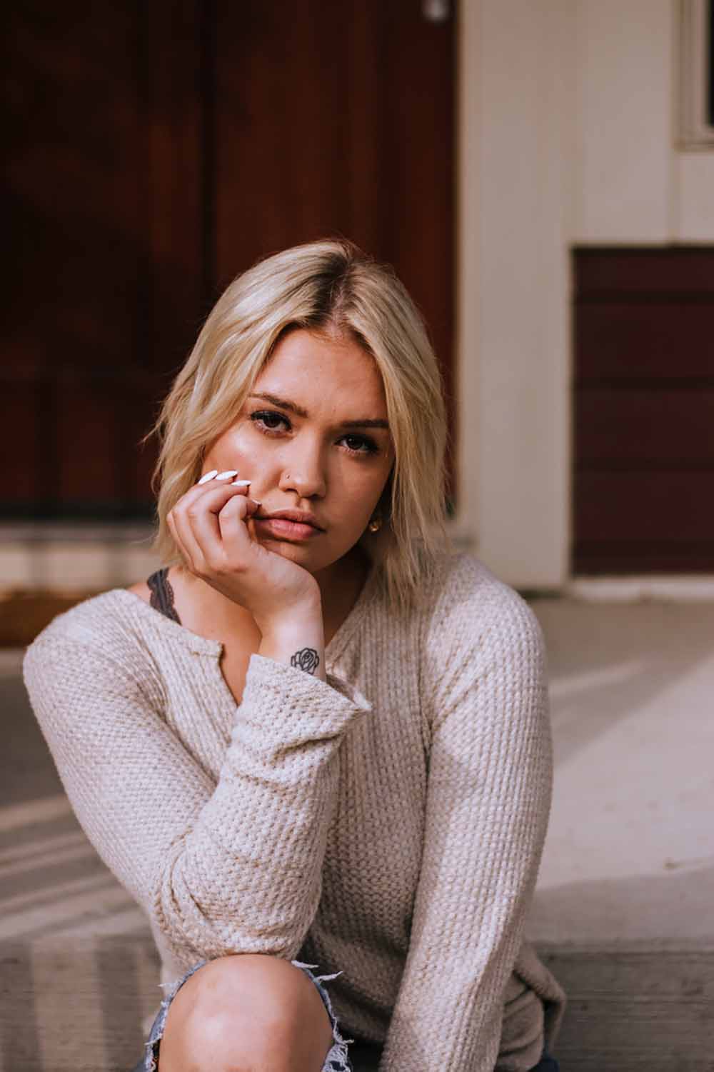 girl model poses for photoshoot in thick sweater