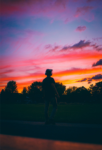 Person Standing infront of sunset wall art