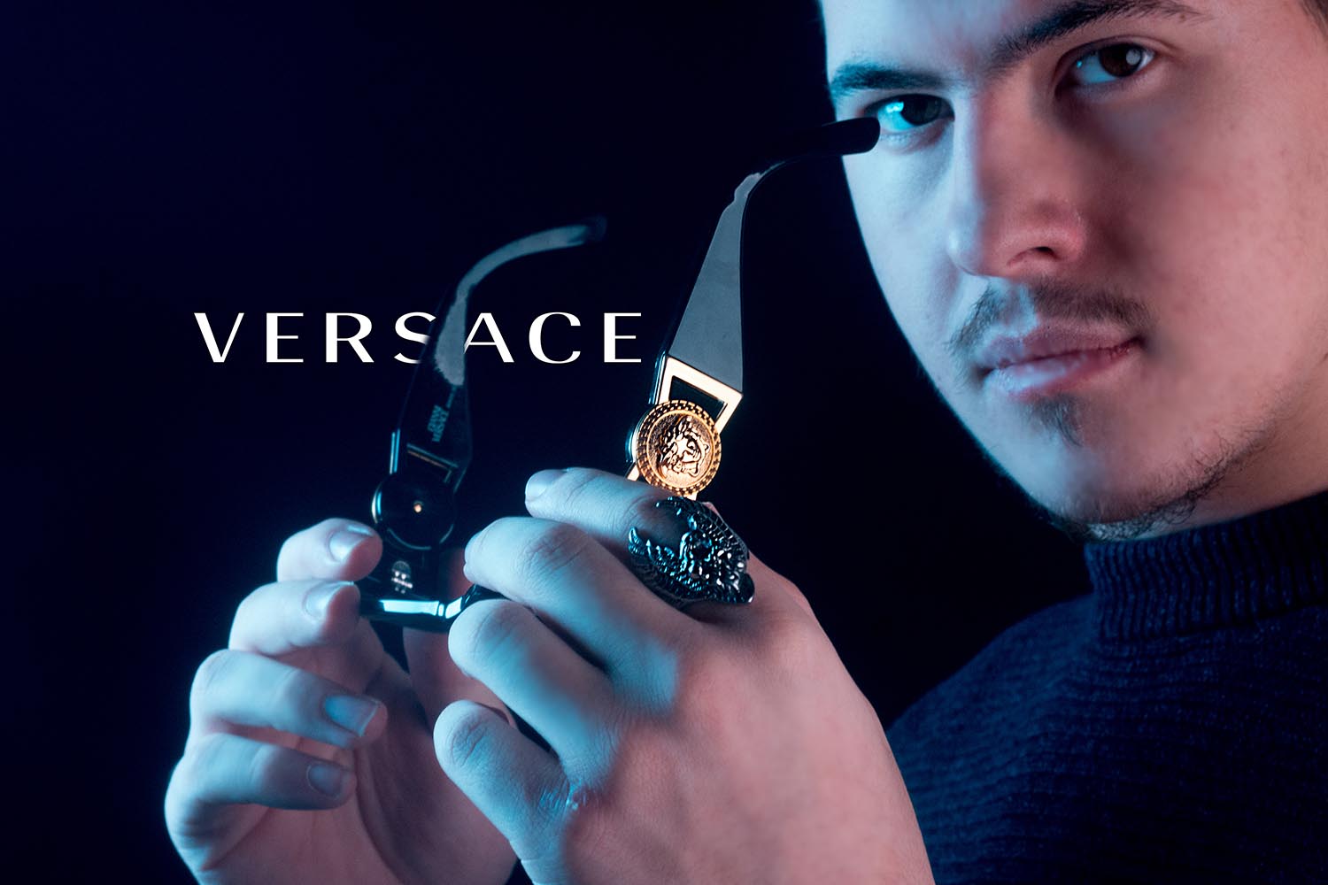 Male holding versace sunglass for product photographer, Milwaukee Wisconsin